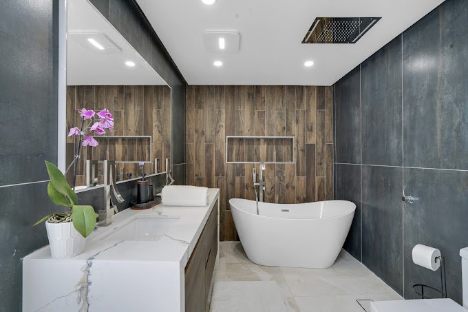 a bathroom with a tub and sink